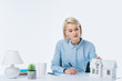 © LIGHTFIELD STUDIOS - portrait of focused real estate agent working at workplace
