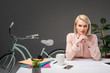 © LIGHTFIELD STUDIOS - portrait of pensive businesswoman at workplace with documents, smartphone and cup of coffee