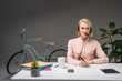 © LIGHTFIELD STUDIOS - portrait of call center operator in headset at workplace isolated on grey