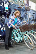 © Sergey Ryzhov - Woman chooses bicycle in shop