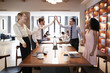 © Monkey Business - Four colleagues celebrating success in an open plan office