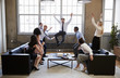 © Monkey Business - Business team jump for joy at hitting target in meeting