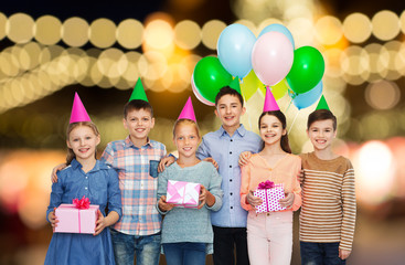 Canvas Print - happy children with gifts at birthday party