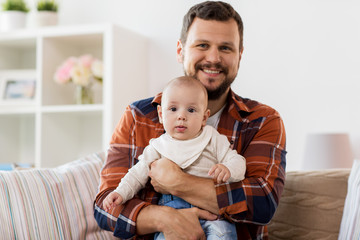 Poster - happy father with little baby boy at home