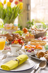 Wall Mural - Table with delicatessen ready for Easter brunch