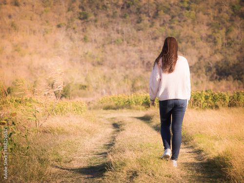 Backside From Young Long Hair Woman With Winter Cloth Walk And