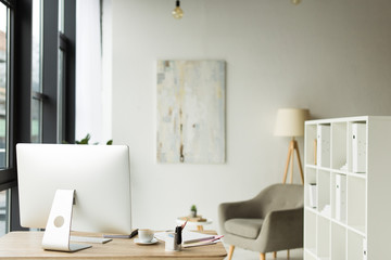 Wall Mural - modern office interior with desktop computer and papers on table