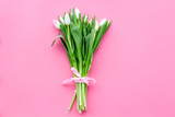 Fototapeta Lawenda - Pale pink spring tulips on pastel pink background top view copy space