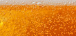 Macro shot of beer bubbles with foam
