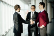 © F8  \ Suport Ukraine - Business partners shaking hands in meeting hall. Business meet.