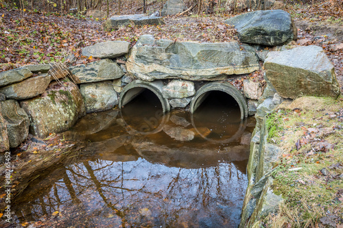 Fotografia, Obraz Water drainage, Culverts, concrete tubes leading the water under a road