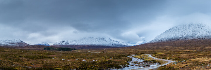 landscape view of scotland and buchaille etive mor in glencoe in the remote highlands of scotland with snow capped peaks in winter