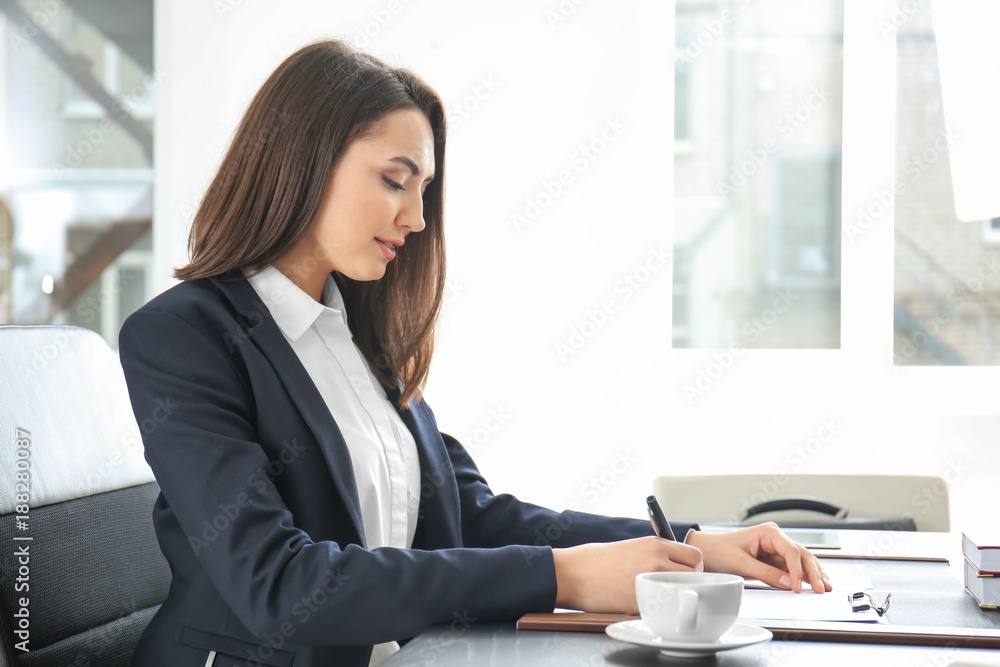 Attractive young lawyer in office