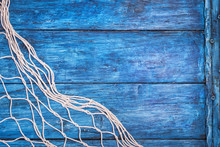 Old Blue Board With Fishing Net With Copy Space