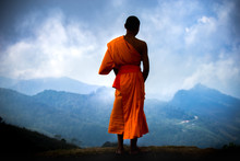 The Young Monk Standing Over Landscape In Thailand.