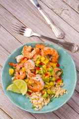 Wall Mural - Shrimps with mango avocado salsa and cauliflower rice. View from above, top, vertical