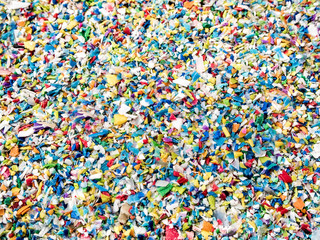 crushed plastic, prepared to be re-melted to recycled plastic pellets
