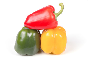 Green red and yellow peppers isolated