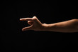 © Prostock-studio - Male hand measuring something, cutout, gesture