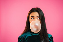 Asian Woman Blowing Gum Bubble