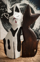 Black And White Papier Mache Cat And A Wooden Cat On The Blurred, Black&white Background