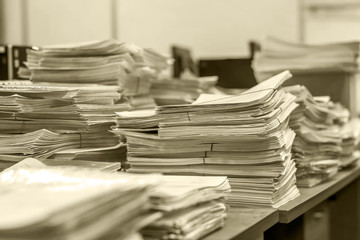 Wall Mural - bundles bales of paper documents. stacks packs pile on the desk in the office in black and white. mountain of waste paper