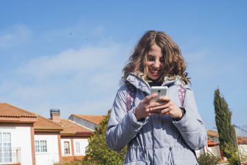 Wall Mural - teenage girl student with smartphone