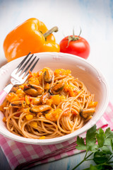 Wall Mural - pasta with mussel capsicum and tomato sauce, selective focus