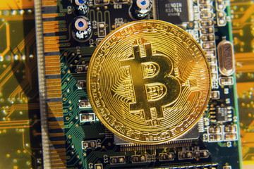 Wall Mural - golden bitcoin coin lying on green computer keyboard, cryptocurrency bubble investing concept