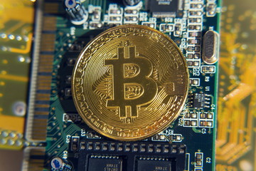 Wall Mural - golden bitcoin coin lying on green computer keyboard, cryptocurrency bubble investing concept