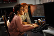 © BalanceFormCreative - Two female programmers working on new project.They working late at night at the office.