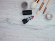 Wooden white background with tree brushes and lipstick