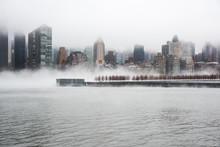 A Dense Fog Covered New York City During The Winter's Day On January Of 2018. View Of Manhattan And Roosevelt Island.