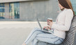 © Prostock-studio - Caucasian businesswoman working with laptop outdoors