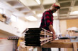 © ADDICTIVE STOCK - Unfocused carpenter carrying wood