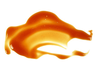 Delicious caramel sauce on white background