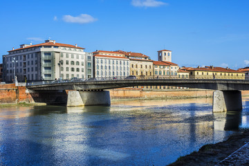 Picturesque Arno River embankment with colorful old houses in Pisa. Pisa, Tuscany, Italy, Europe.