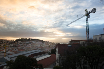 A construction crane above the downtown of Lisboa (Portugal)