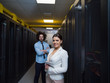 © .shock - engineer showing working data center server room to female chief