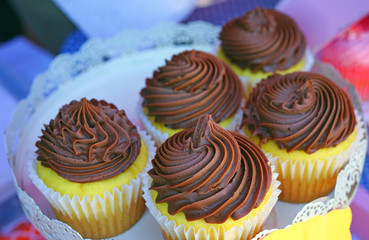 Wall Mural - Platter of chocolate cupcakes with buttercream frosting