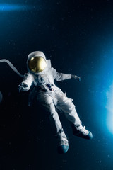 Wall Mural - astronaut floating in outer space , high contrast image