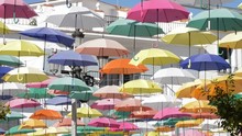 Color Umbrella Heap In A Village Square A Sunny Day