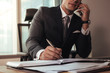 © Jacob Lund - Businessman working at his desk