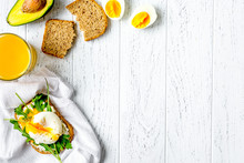 Sandwich With Poached Eggs On Wooden Background Top View Mockup