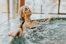 Young Woman Relaxing In The Whirlpool Bathtub