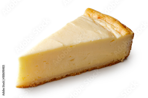 A slice of plain baked cheesecake isolated on white. Lerretsbilde