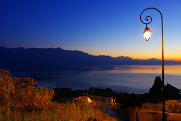 Wall Mural - Sunset light over the vineyard terraces of Lavaux wine region (UNESCO World Heritage Site since 2007) overlooking the northern shores of Lake Geneva, Canton of Vaud, Switzerland