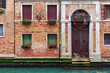 Facade of typical brick building in Venice, Italy.