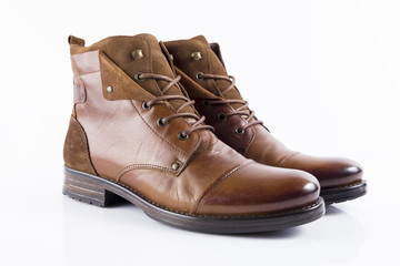 Male brown leather boot on white background, isolated product, comfortable footwear.