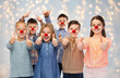 © Syda Productions - happy children showing thumbs up at red nose day